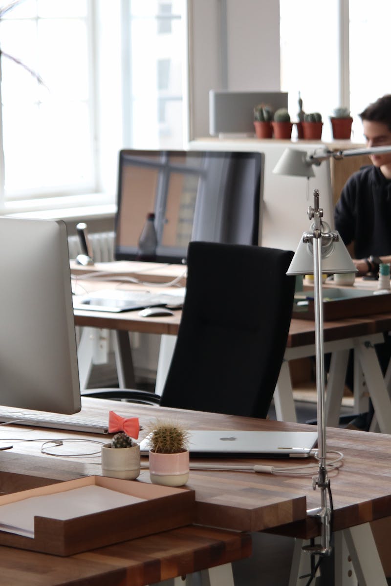 Man Sitting in Front of Computer